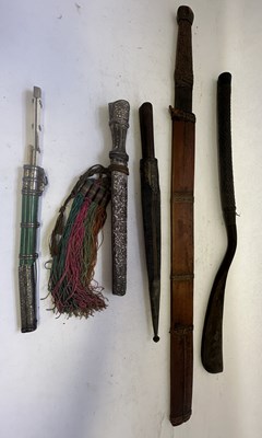 Lot 522 - A BHUTANESE DAGGER, AN INDIAN KARD, A CHINESE CUTLERY SET, A MALAYSIAN SWORD