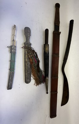 Lot 522 - A BHUTANESE DAGGER, AN INDIAN KARD, A CHINESE CUTLERY SET, A MALAYSIAN SWORD
