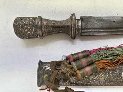 Lot 522 - A BHUTANESE DAGGER, AN INDIAN KARD, A CHINESE CUTLERY SET, A MALAYSIAN SWORD