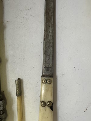 Lot 522 - A BHUTANESE DAGGER, AN INDIAN KARD, A CHINESE CUTLERY SET, A MALAYSIAN SWORD
