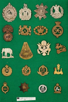 Lot 681 - A COLLECTION OF 20 METAL MILITARY BADGES