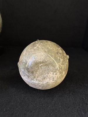 Lot 66 - A ROMAN PALE GREEN GLASS SPRINKLER FLASK, CIRCA 3RD-4TH CENTURY A.D.