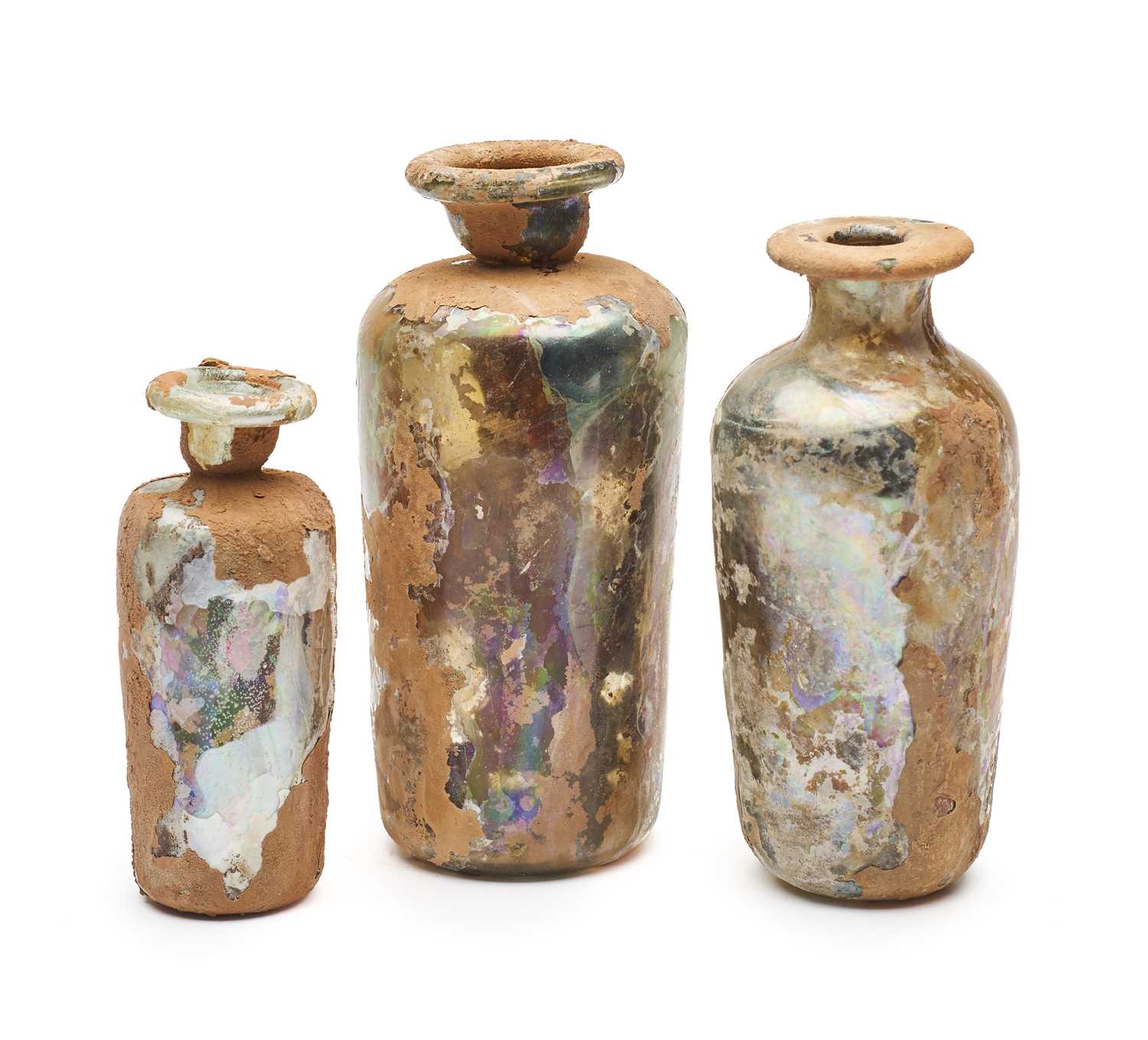 Lot 75 - THREE ROMAN CYLINDRICAL GLASS VESSELS, CIRCA 3RD-4TH CENTURY A.D.