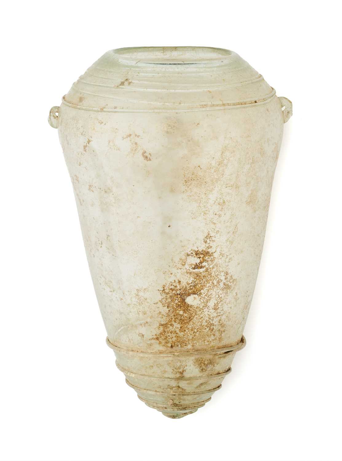 Lot 70 - A LATE ROMAN OR BYZANTINE COLOURLESS GLASS VESSEL, 4TH-6TH CENTURY A.D.