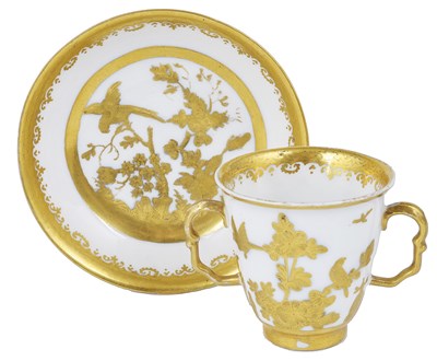 Lot 317 - A MEISSEN TWO-HANDLED BEAKER AND SAUCER WITH AUGSBURG GILT DECORATION