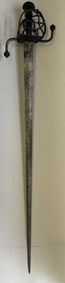 Lot 28 - A NORTH EUROPEAN BASKET-HILTED MILITARY BACKSWORD (TESSAK), LATE 16TH CENTURY