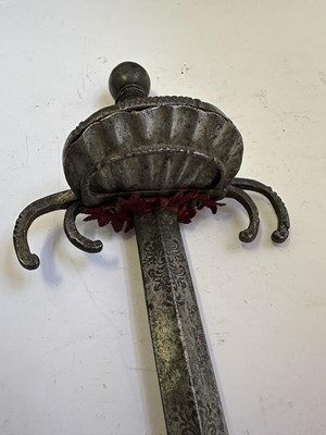Lot 67 - AN ITALIAN SWORD WITH ‘CRAB-CLAW’ HILT, MID-17TH CENTURY, POSSIBLY VENETIAN