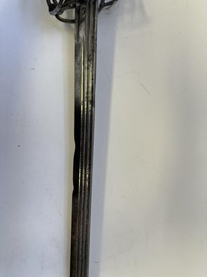 Lot 49 - AN ENGLISH BASKET-HILTED BACKSWORD, CIRCA 1650-90