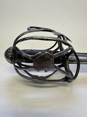 Lot 49 - AN ENGLISH BASKET-HILTED BACKSWORD, CIRCA 1650-90
