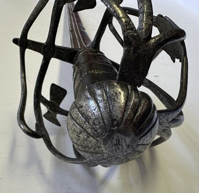 Lot 49 - AN ENGLISH BASKET-HILTED BACKSWORD, CIRCA 1650-90