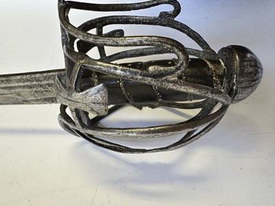Lot 49 - AN ENGLISH BASKET-HILTED BACKSWORD, CIRCA 1650-90