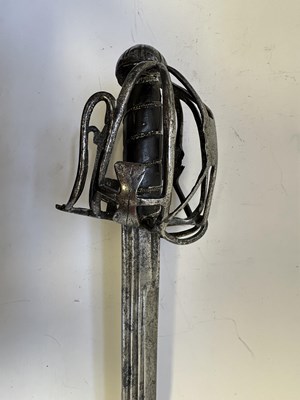 Lot 49 - AN ENGLISH BASKET-HILTED BACKSWORD, CIRCA 1650-90