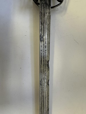 Lot 49 - AN ENGLISH BASKET-HILTED BACKSWORD, CIRCA 1650-90