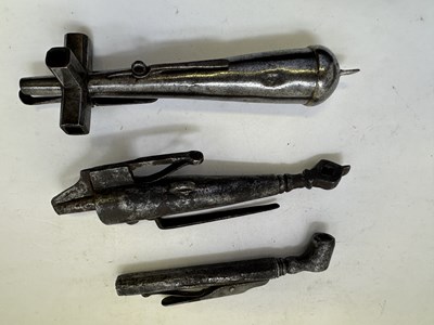 Lot 83 - TWO GERMAN COMBINED POWDER-FLASKS, WHEEL-LOCK SPANNERS AND TURNSCREWS, 17TH CENTURY