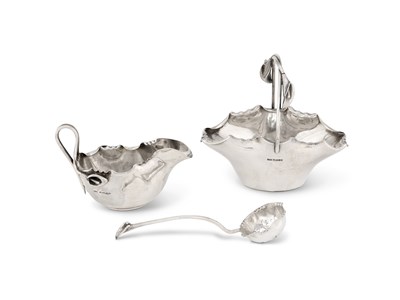 Lot 237 - A VICTORIAN AESTHETIC MOVEMENT SILVER CREAM BOAT, SUGAR BOWL AND SIFTER SPOON, JAMES DIXON & SONS, SHEFFIELD, 1887 / 89