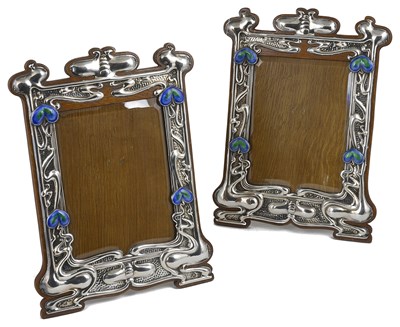 Lot 387 - A PAIR OF EDWARDIAN SILVER-MOUNTED PHOTOGRAPH FRAMES