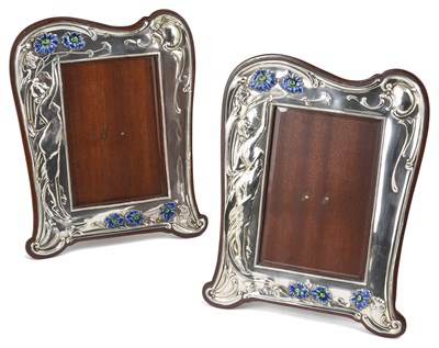 Lot 388 - A MATCHED PAIR OF EDWARDIAN SILVER-MOUNTED PHOTOGRAPH FRAMES