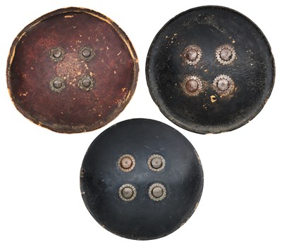 Lot 577 - THREE INDIAN CIRCULAR HIDE SHIELDS (DHALS), 19TH CENTURY