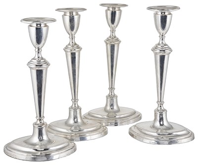 Lot 414 - A SET FOUR GEORGE V SILVER CANDLESTICKS