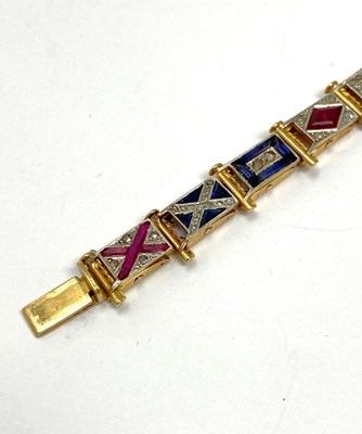 Lot 440 - GOLD, GEM-SET AND DIAMOND NAUTICAL FLAG BRACELET, 1920s