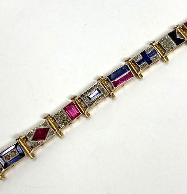 Lot 440 - GOLD, GEM-SET AND DIAMOND NAUTICAL FLAG BRACELET, 1920s