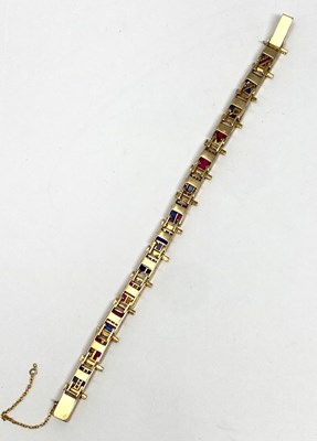 Lot 440 - GOLD, GEM-SET AND DIAMOND NAUTICAL FLAG BRACELET, 1920s