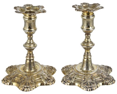 Lot 448 - A PAIR OF GEORGE II SILVER-GILT DWARF CANDLESTICKS