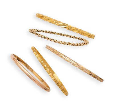 Lot 332 - A COLLECTION OF TEN GOLD AND ROLLED GOLD BANGLES, 1920s AND LATER