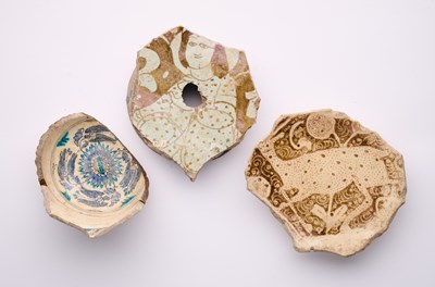 Lot 235 - THREE ISLAMIC POTTERY FRAGMENTS
