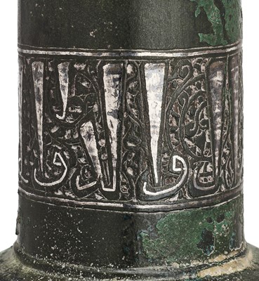 Lot 85 - A KHORASAN SILVER INLAID BRONZE CANDLESTICK SECTION, PERSIA, CIRCA 13TH CENTURY