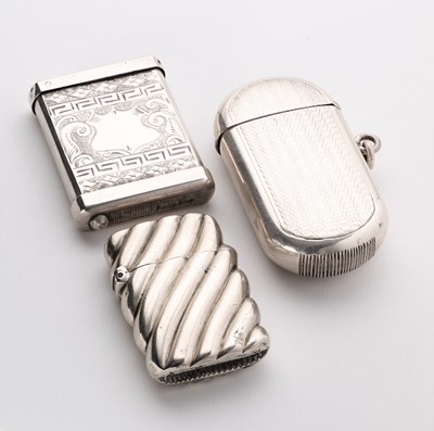 Lot 44 - THREE VICTORIAN SILVER VESTA CASES, BIRMINGHAM, 1875 / 79 / 88