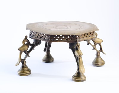 Lot 334 - A BRASS FOOTED STAND, INDIA, CIRCA 1900