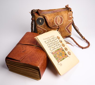 Lot 259 - A QUR'AN AND LEATHER CASE, NORTH AFRICA