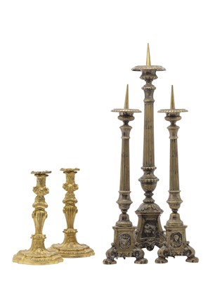 Lot 18 - A PAIR OF SILVERED BRASS BAROQUE STYLE ALTAR CANDLESTICKS