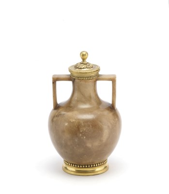 Lot 20 - AN ORMOLU-MOUNTED EGYPTIAN ALABASTER JAR AND COVER