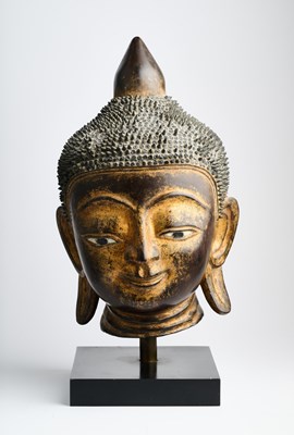 Lot 303 - A GILT LACQUER HEAD OF BUDDHA, BURMA (NOW MYANMAR), 19TH CENTURY