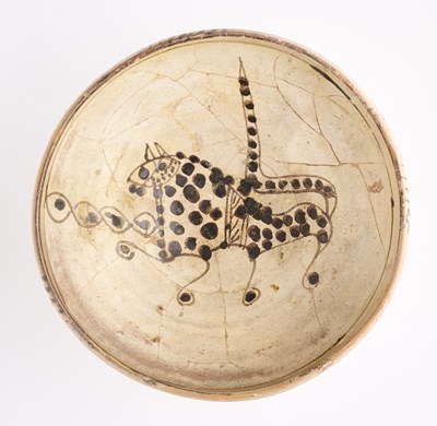 Lot 86 - A NISHAPUR SLIP PAINTED BOWL, PERSIA, CIRCA 10TH CENTURY