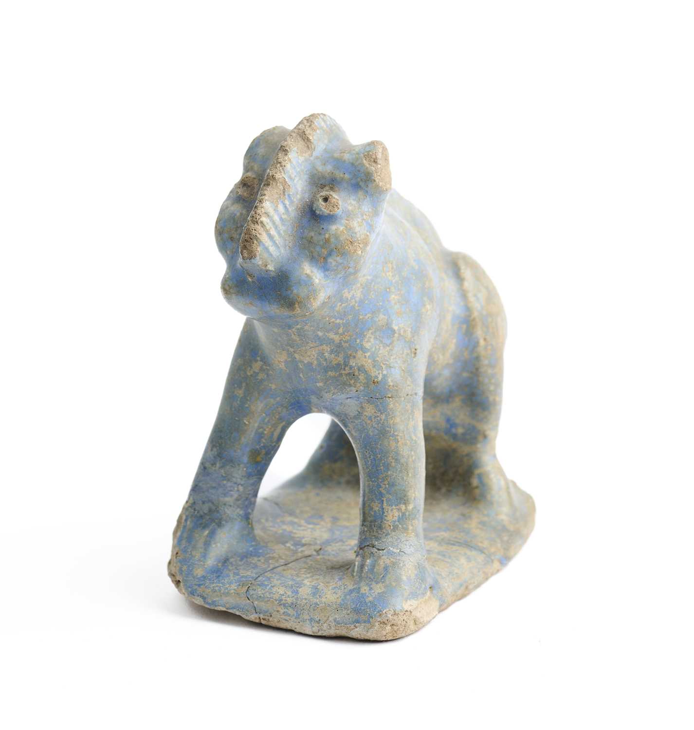 Lot 77 - A KASHAN TURQUOISE GLAZE POTTERY FIGURE OF A LION, PERSIA, 12TH/13TH CENTURY