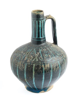 Lot 80 - A KASHAN SILHOUETTE-WARE EWER, PERSIA, CIRCA 1200