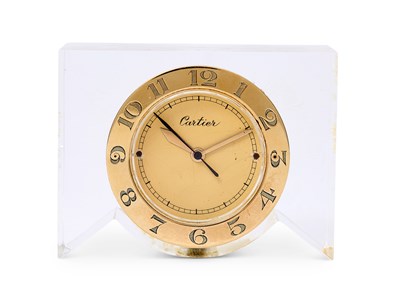 Lot 301 - CARTIER: A GOLD AND LUCITE DESK CLOCK, CIRCA 1950