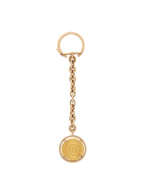 Lot 302 - A FATIMID GOLD DINAR COIN SET IN AN EGYPTIAN KEYRING, CAIRO, CIRCA 1960