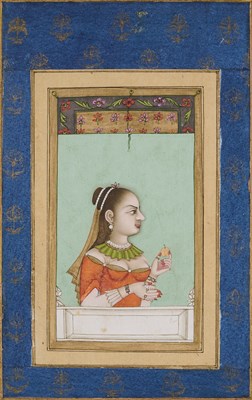 Lot 329 - A LADY IN EUROPEAN DRESS HOLDING AN FRUIT, MUGHAL, PROBABLY LUCKNOW, 18TH CENTURY