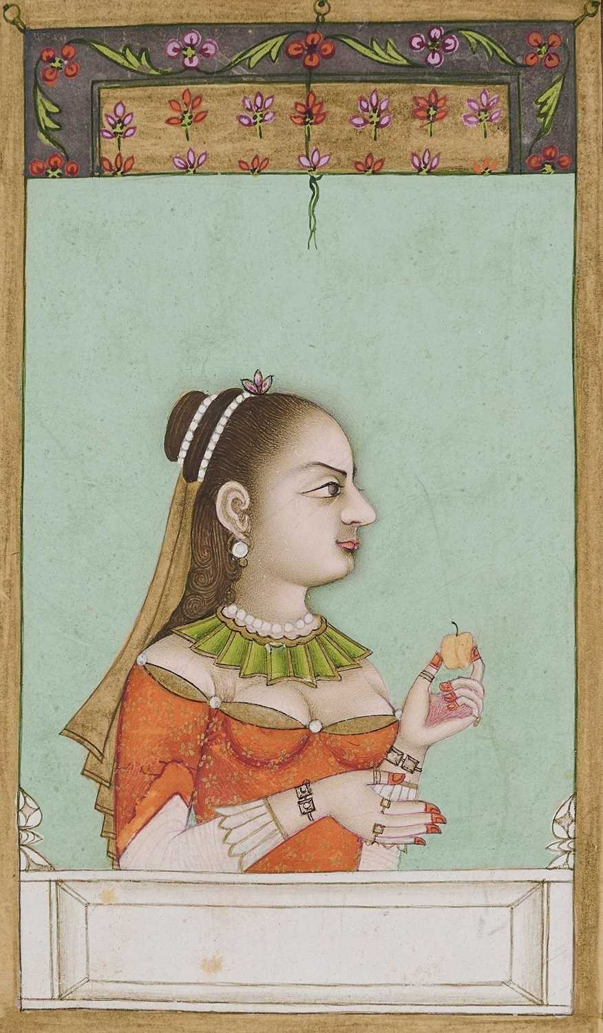 Lot 329 - A LADY IN EUROPEAN DRESS HOLDING AN FRUIT, MUGHAL, PROBABLY LUCKNOW, 18TH CENTURY