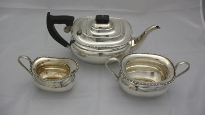 Lot 70 - A THREE-PIECE SILVER TEA SET