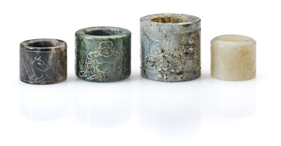 Lot 89 - FOUR CHINESE INSCRIBED AND CARVED JADE ARCHERS RINGS, QING DYNASTY, 18/19TH CENTURY