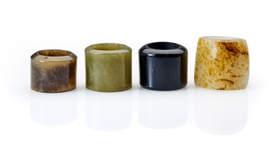 Lot 90 - FOUR CHINESE JADE ARCHERS RINGS, QING DYNASTY, 19TH CENTURY