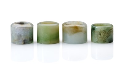 Lot 88 - THREE CHINESE JADEITE ARCHERS RINGS, QING DYNASTY, 19TH CENTURY