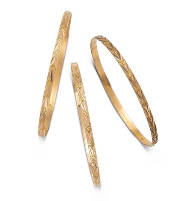 Lot 378 - THREE GOLD BANGLES, 1920s