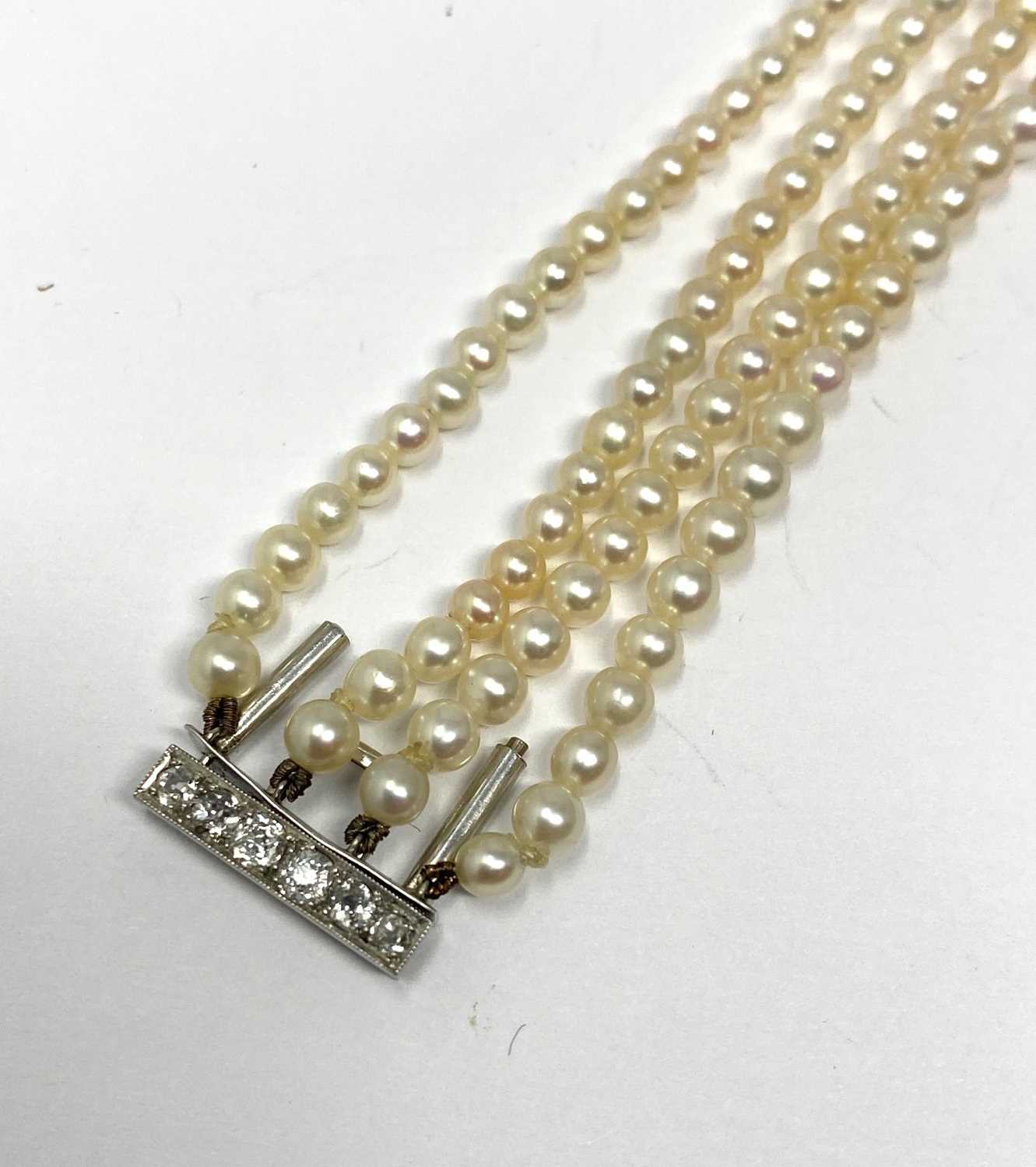 Lot 445 - PICKSLAY & CO: BELLE EPOQUE SEED PEARL AND DIAMOND BRACELET, 1900s