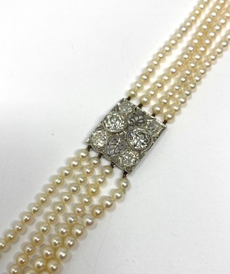 Lot 445 - PICKSLAY & CO: BELLE EPOQUE SEED PEARL AND DIAMOND BRACELET, 1900s